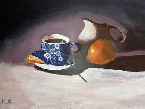 Still life with cup of coffee and lemon